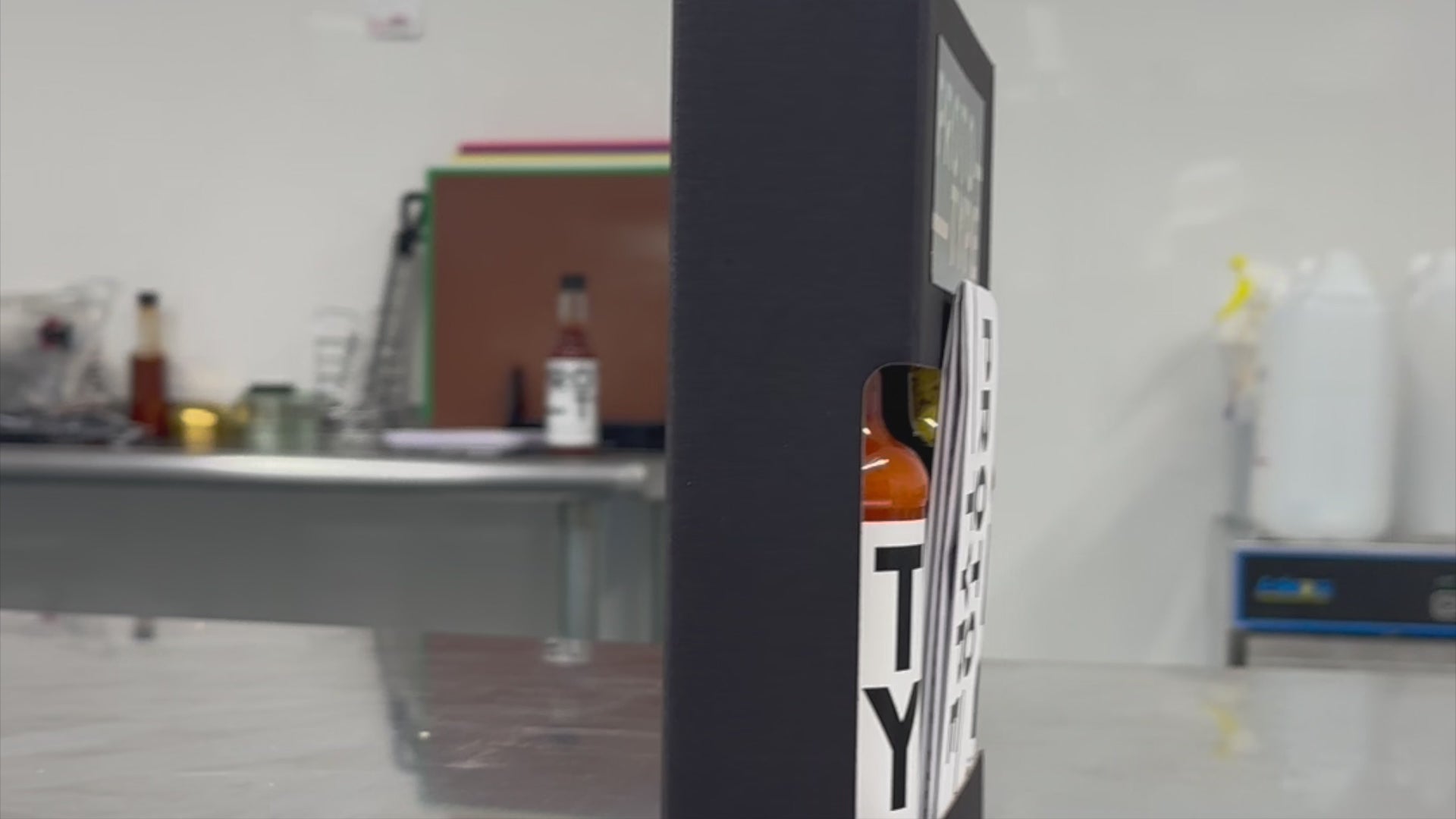 Load video: Rotating around the prototype club box, showing three sauces and and a folded info sheet